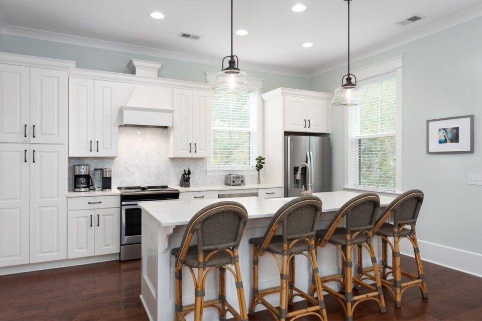 Fully-equipped kitchen with bar seating, ideal for cooking and gathering.