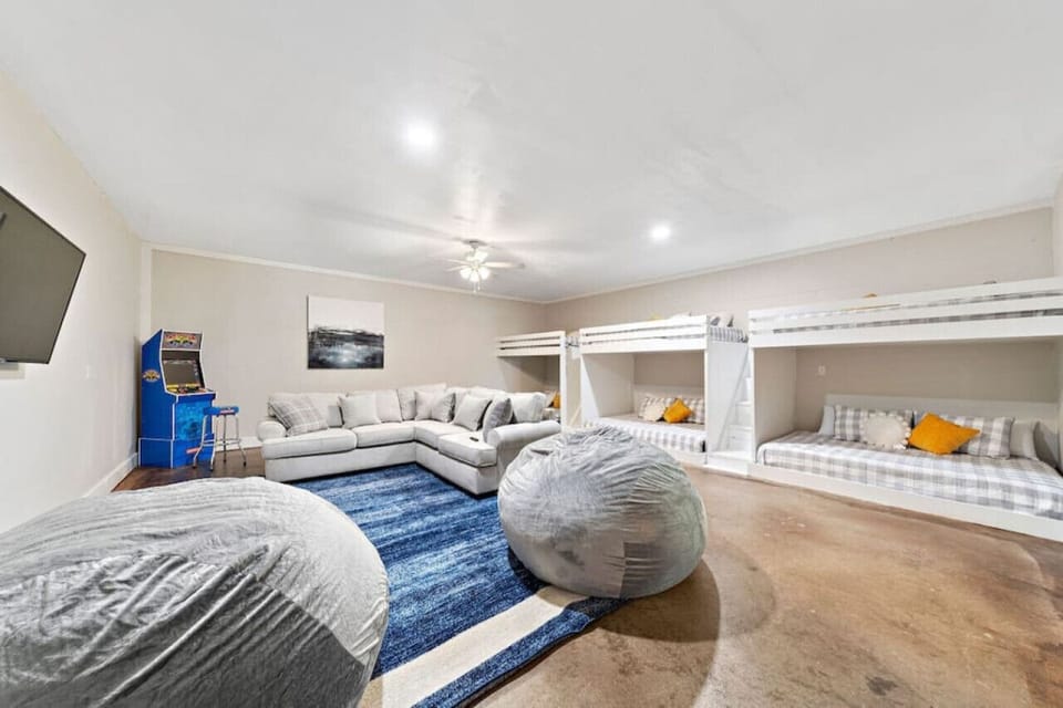 This bedroom has 3 double over queen bunk beds