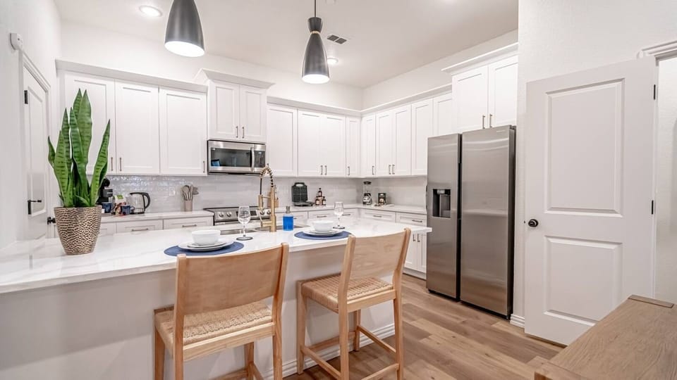 A fully equipped chef's kitchen with everything you need for a home-cooked meal or game day prep. Full-size appliances, cookware, utensils, and counter space to spare — because not every great meal should come from DoorDash.