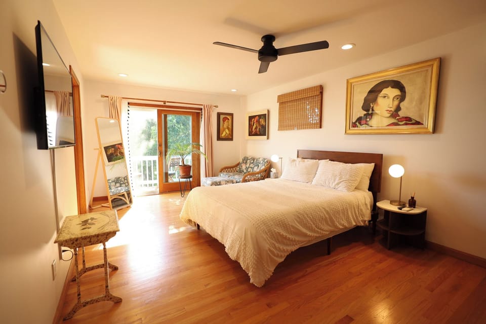 Primary Bedroom - (Queen Bed) with attached bath and private patio