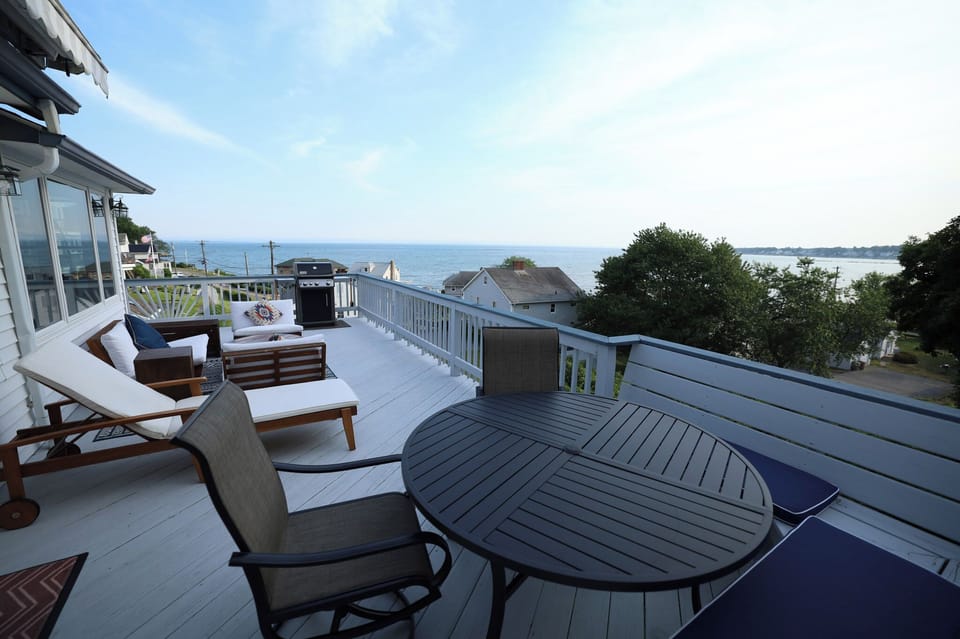 Large Deck w/multiple seating areas, adjustable awning & propane fire pit