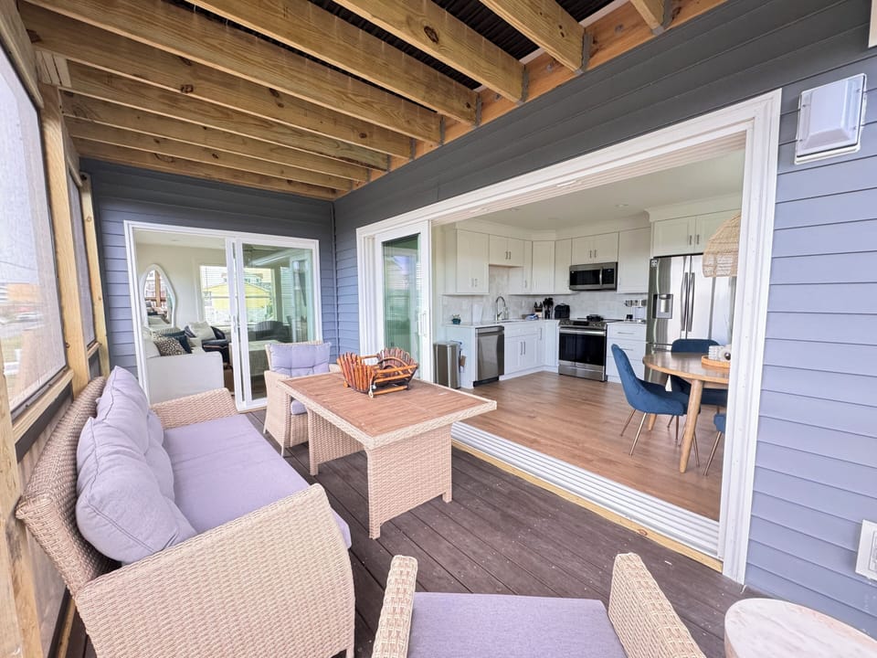 First floor screened porch w 12’ slider open for indoor outdoor living