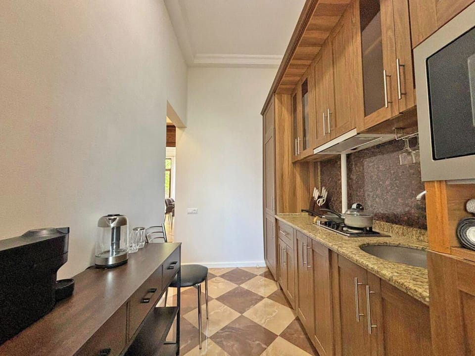 Kitchen, refrigerator, stove, microwave, Nespresso coffee machine 