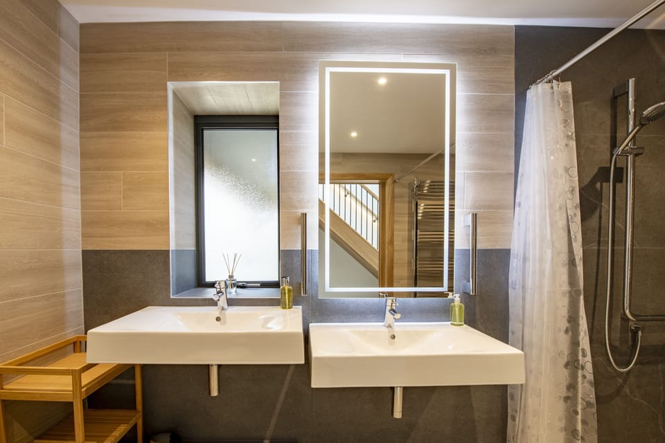 Ground floor: Wet room featuring two sinks at different heights