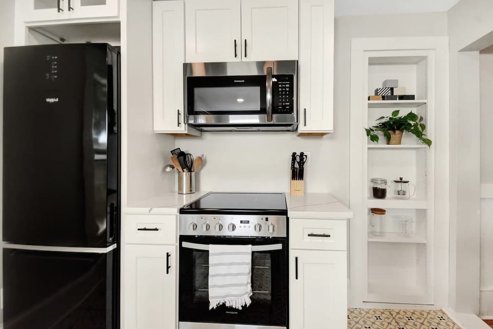 Full kitchen with stove, refrigerator, microwave, and dish washer. 