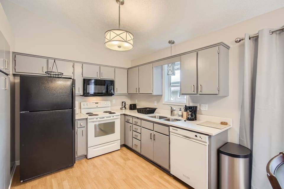 The kitchen is equipped with ample cupboards