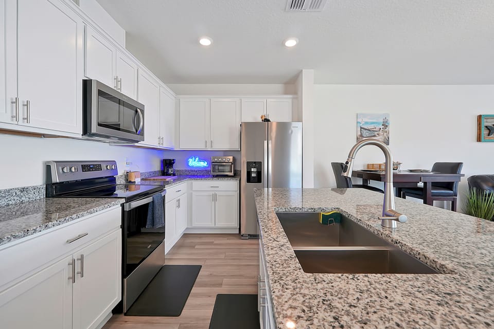 Large Granite Kitchen Island for a family style meal.
