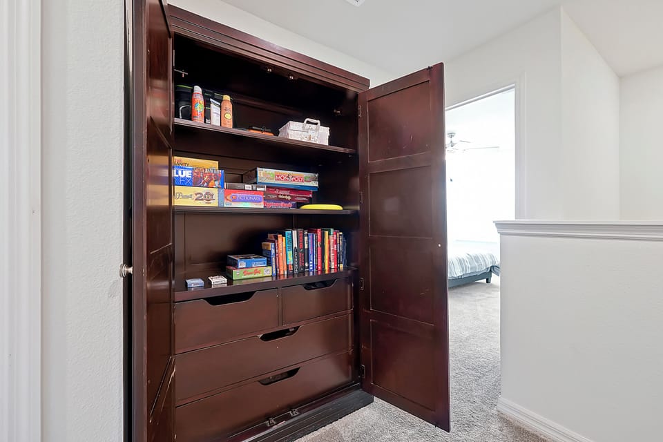 Game Closet with Plenty of Board Games for a great night in!