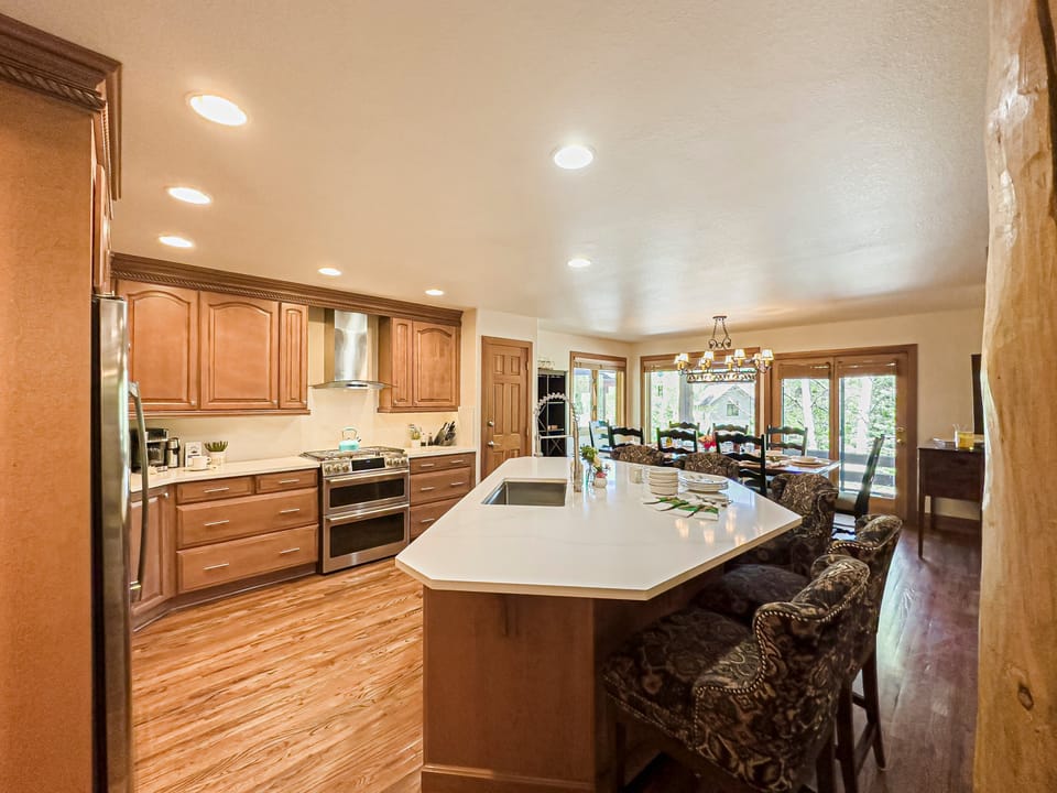 Fully equipped kitchen with stainless steel appliances and a center island