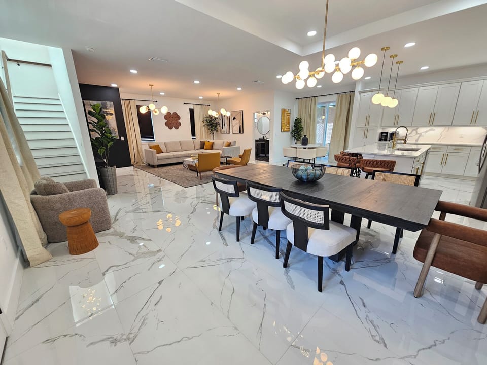 Large open space floorplan with fully stocked kitchen, roomy living room