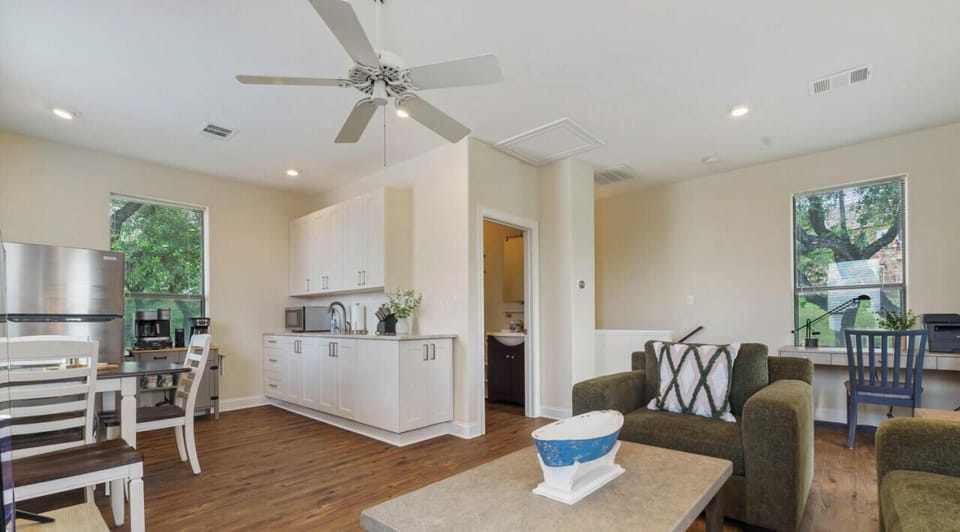 Living area upstairs with sleeper, smart tv, kitchenette, work desk, and balcony!!