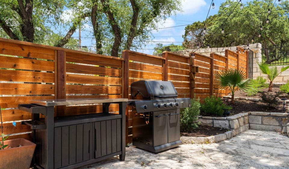 Beautiful shared courtyard with dining, grill, dining, and prep table!