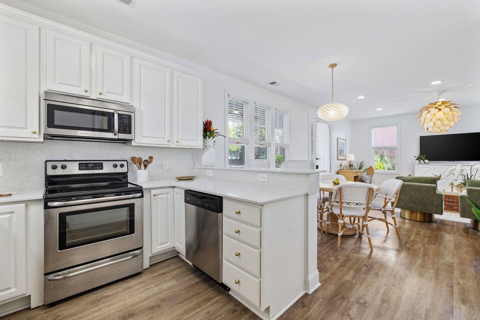 Modern kitchen with granite countertops and solid slab backsplash.