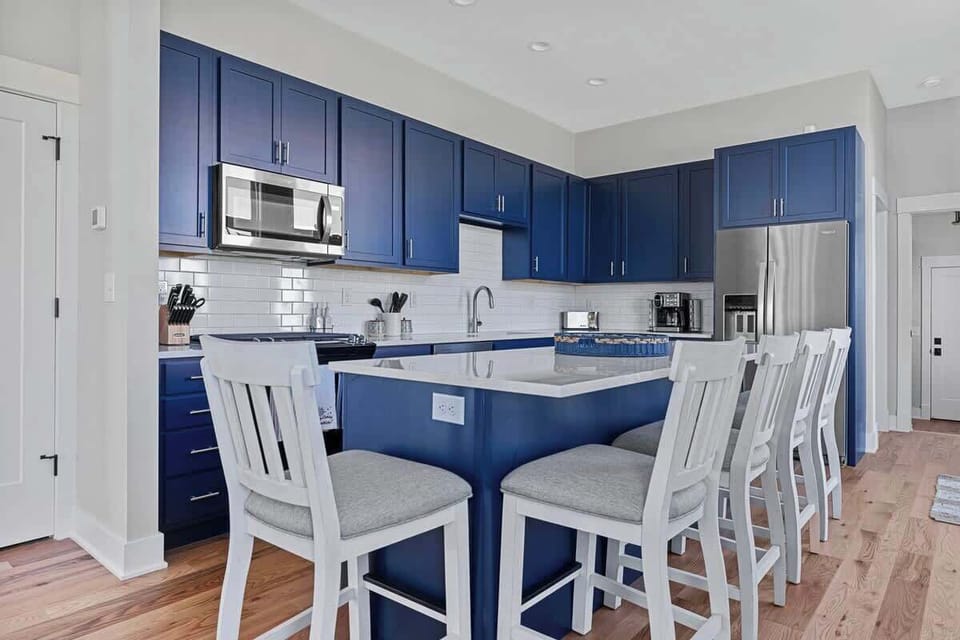 With seating for 5, the kitchen's center island is a popular gathering spot.