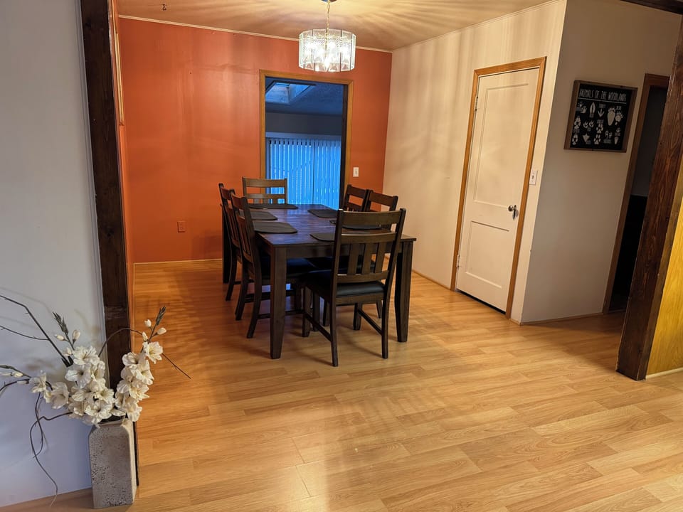 Dinning room with seating for six and room for three at the kitchen bar.