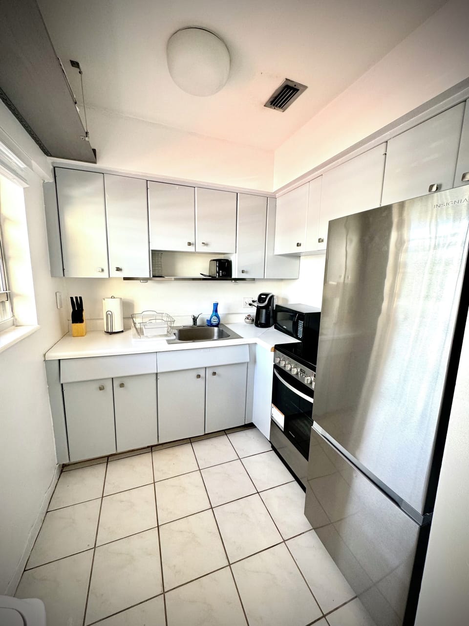 Full kitchen with stainless steel appliances. 
