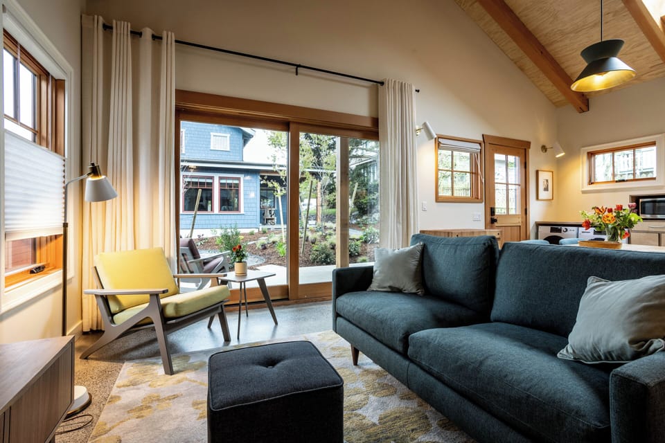 Open plan and beamed ceilings create a light yet cozy living space. 