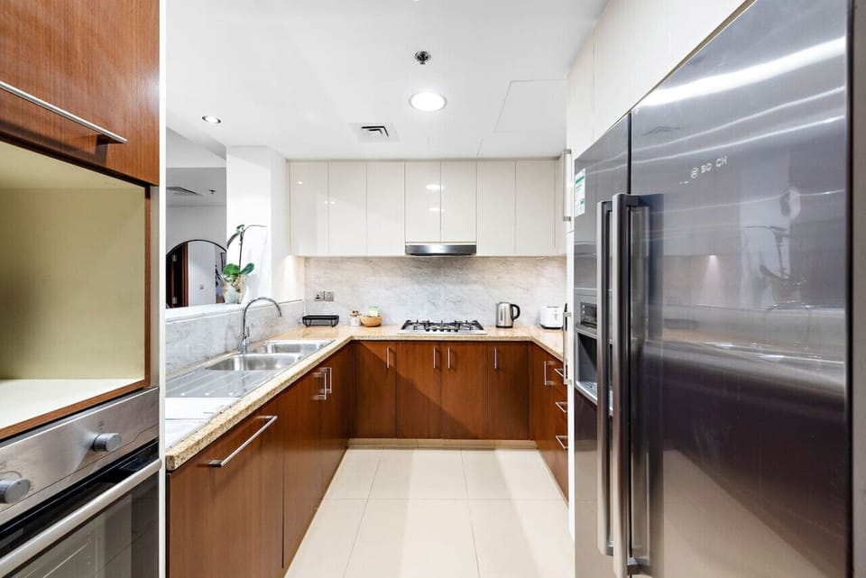 Kitchen: Culinary adventures await in this stylish kitchen with modern appliances and sleek design!