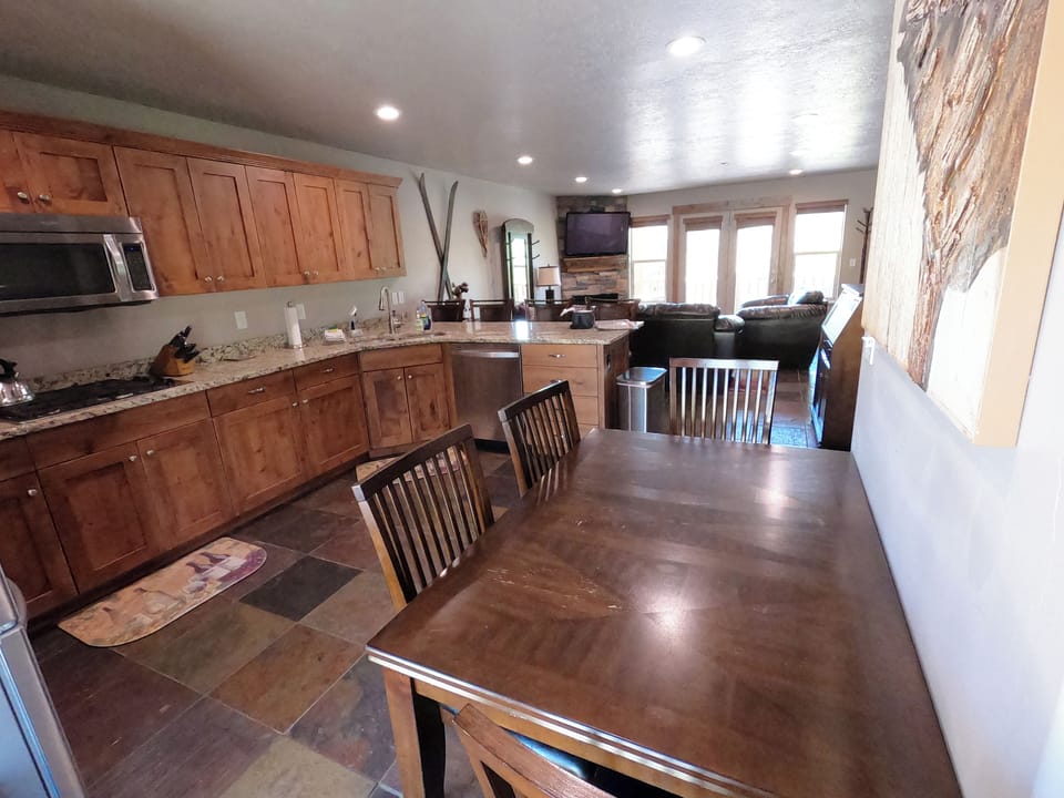 Large kitchen area (special for Moose Hollow condos), Living room with views of Nordic Valley and Snowbasin in the distance