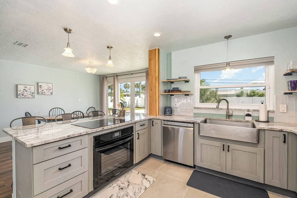 Bright and open with seating island and pool view, granite, everything new