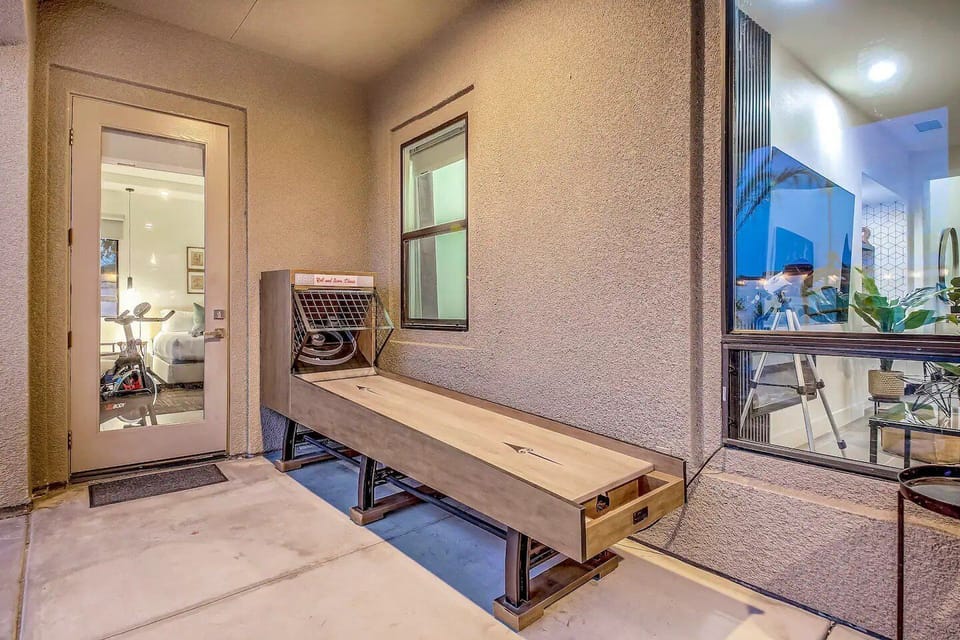 Step outside and challenge your friends to a game of shuffleboard in this cozy covered nook. Perfectly placed between indoor comfort and outdoor excitement, it's the ideal spot for a little friendly competition during your stay.