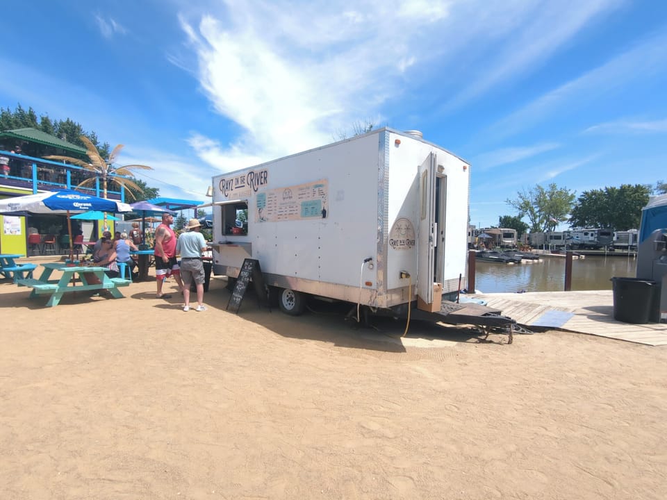 Rayz on the River food truck located at Jimmy Bukkett's - stop by for burger, fries or seafood basket.