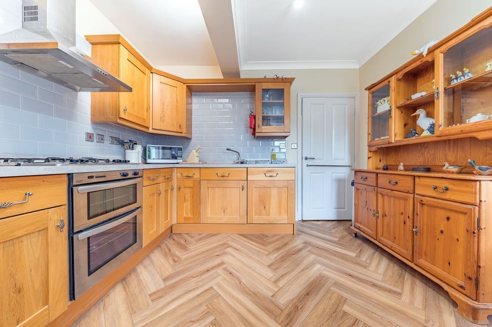 The delightful kitchen has everything that you need to cook dinner during your self catering stay in Keswick