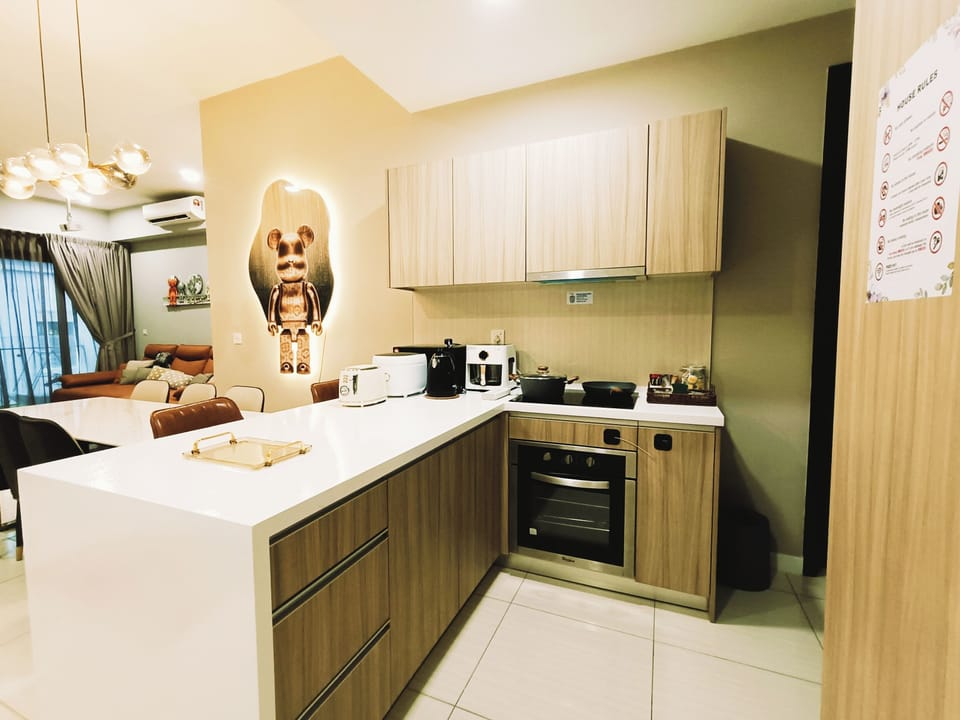 Kitchen with air fryer, toaster, electric kettle, rice maker, coffee & tea.