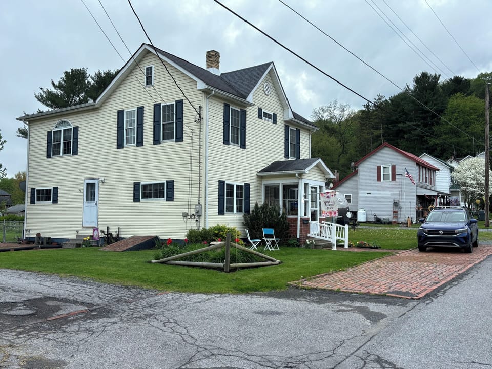 Two additional parking spaces on brick driveway (alley side).