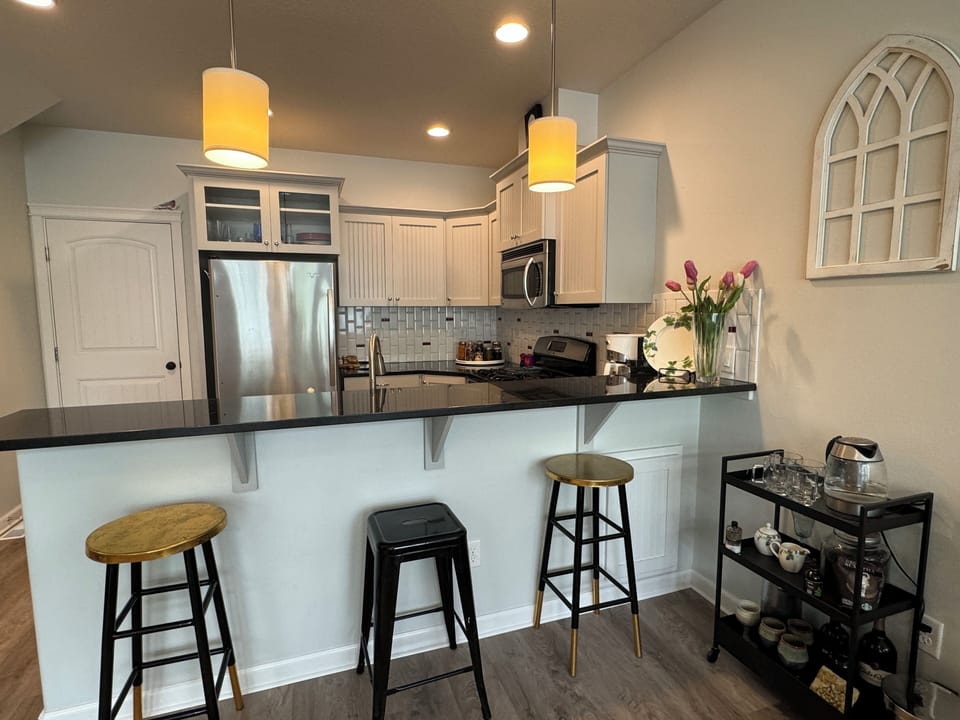 Designer kitchen and eating area, including coffee/wine bar and granite counters