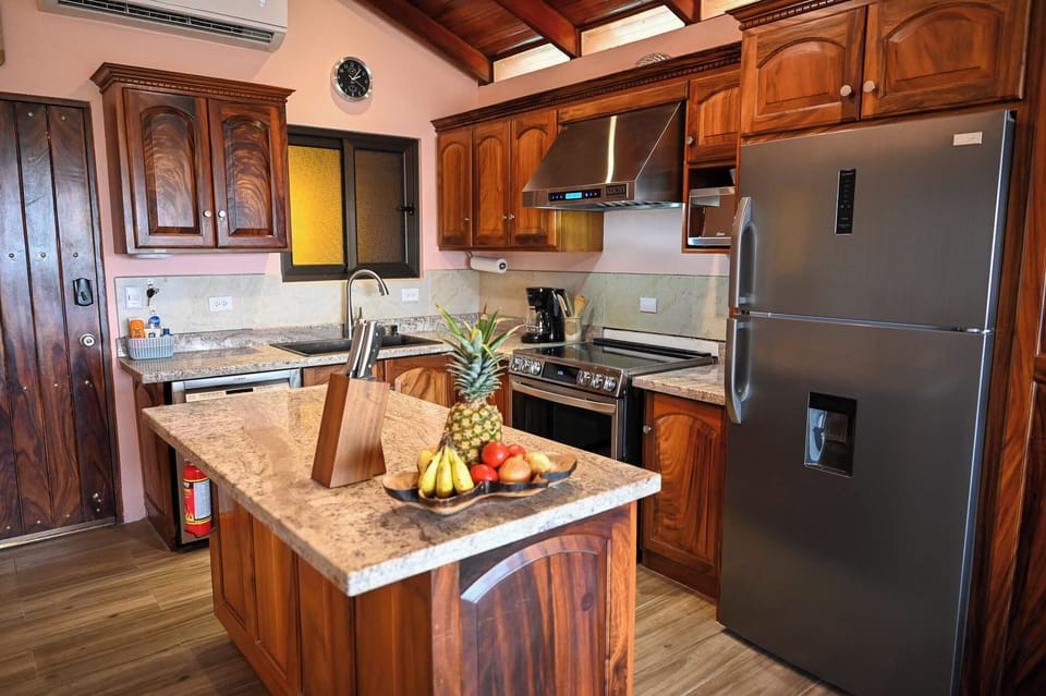 A true Chef's kitchen with top end appliances, sharp knives and utensils.