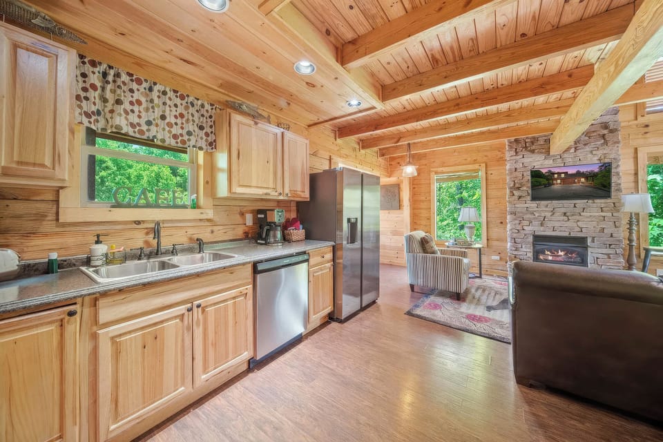 Cook and dine in style with stainless appliances and cabin warmth.