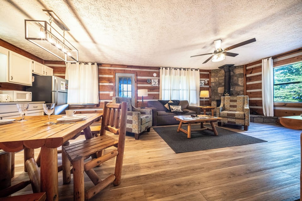 Embrace the mountain vibe with a rustic fireplace and forest views.