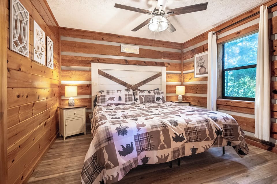 Bedroom: Rustic charm meets modern comfort in this inviting retreat with nature views!