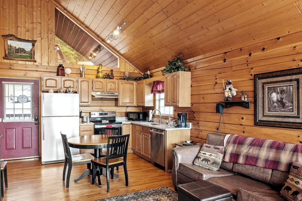 Embrace mountain life in this stylish cabin kitchen with rustic charm and modern amenities!
