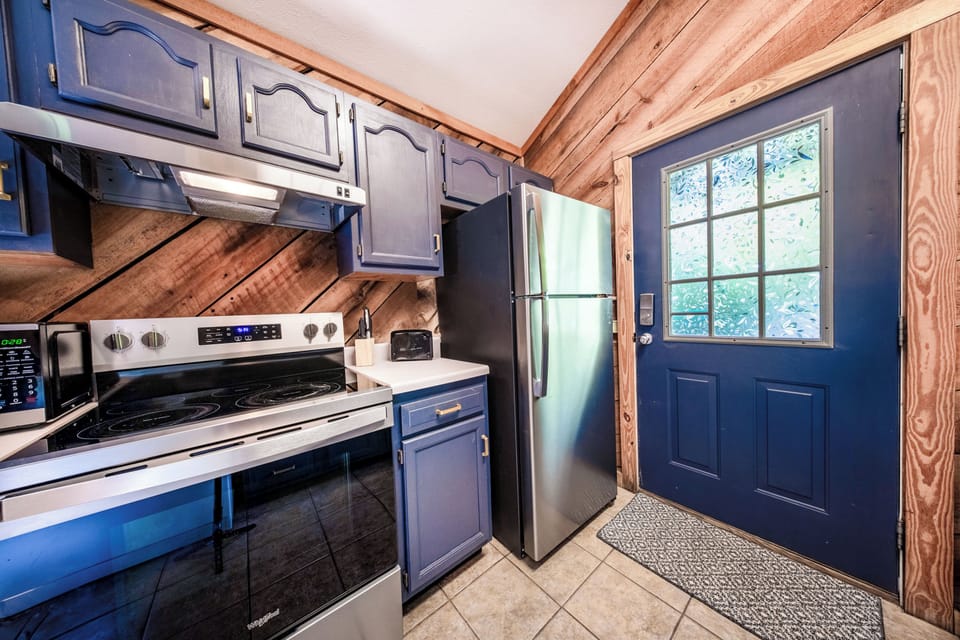 Fully Stocked Haven: Whip up meals with ease in this well-equipped kitchen!