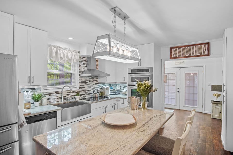 Kitchen Area: Microwave, Electric Stove, Oven, Dishwasher.