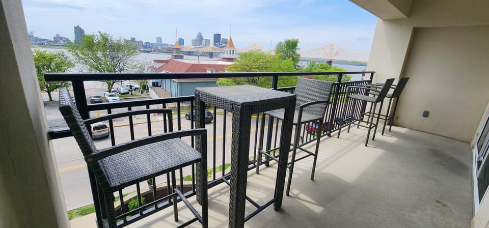 Large balcony overlooking Ohio River and Louisville  downtown skyline 
