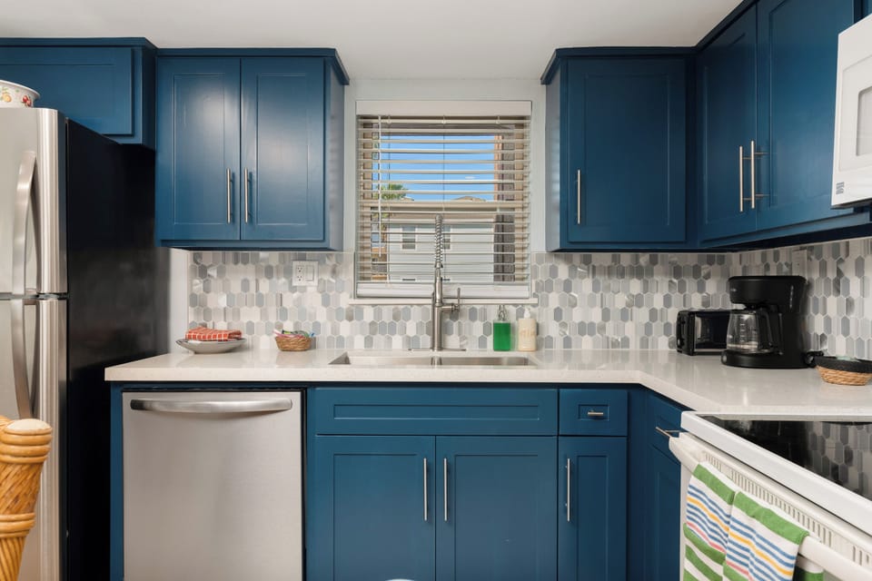 Enjoy our renovated kitchen with stainless steel appliances. It includes an oven, stove top, microwave, dishwasher, refrigerator, along with kitchen ware. We do have a coffee pot, blender, and