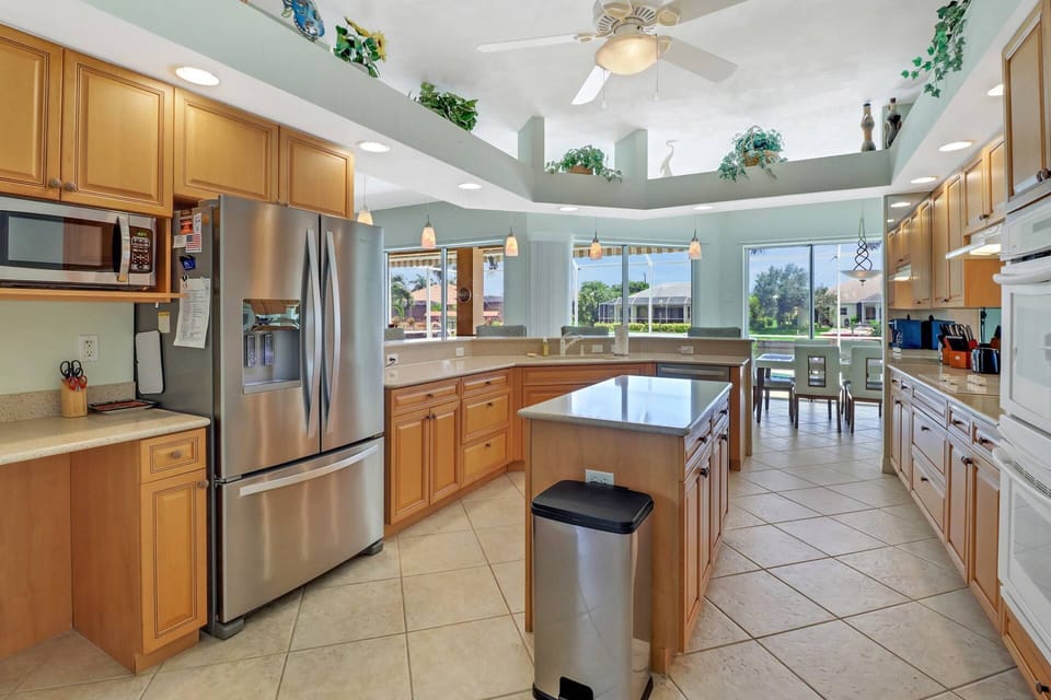 The spacious kitchen is made for guests who love to cook - abundant cabinets and counter space and full size appliances (including double ovens.)