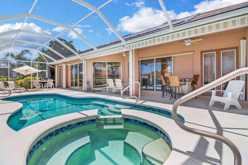 Window and glass doors flank the back of the home - bring the beauty of the outdoor space into the interior of the house.