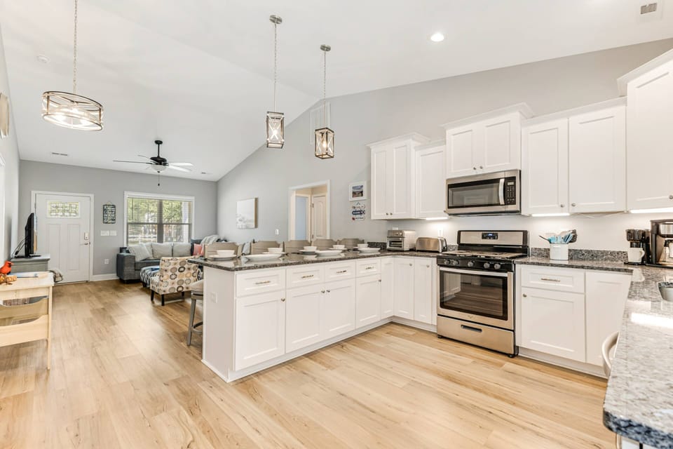 Enjoy the well-stocked kitchen, complete with a stove, microwave, and a coffee maker.