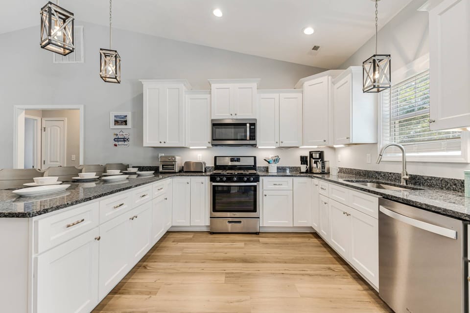 Enjoy the well-stocked kitchen, complete with a stove, microwave, and coffee maker.