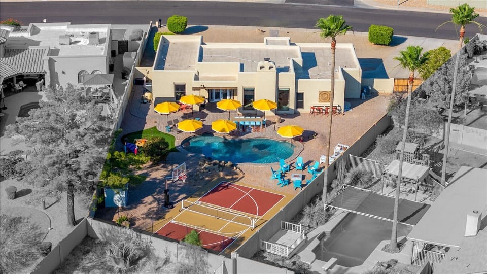 Experience a bird's-eye view of our expansive backyard, showcasing its beauty and amenities from above