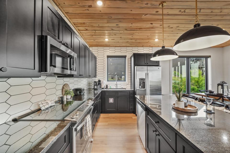 Culinary adventures await in this stylish kitchen with sleek fixtures and natural light!
