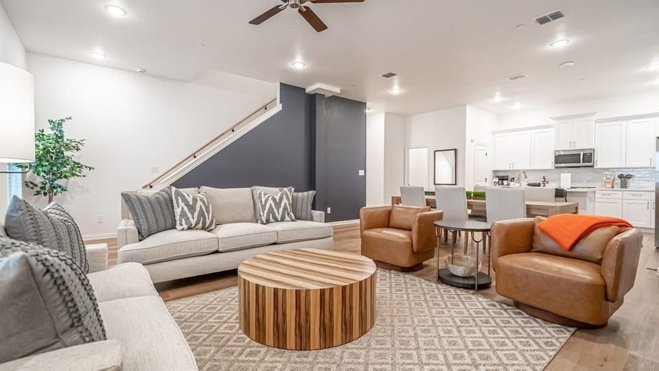 Kick back in a stylish, open-concept living space designed for comfort and connection. Whether you're debriefing after a Rangers game, watching pre-game coverage on the smart TV or just relaxing with your crew—The Ryan's living area has you covered.