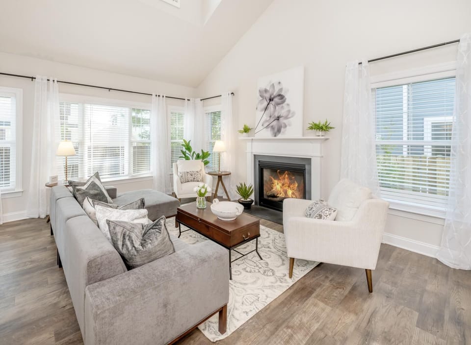 The focal point of the room is a sleek gas fireplace, perfect for adding warmth and ambiance.