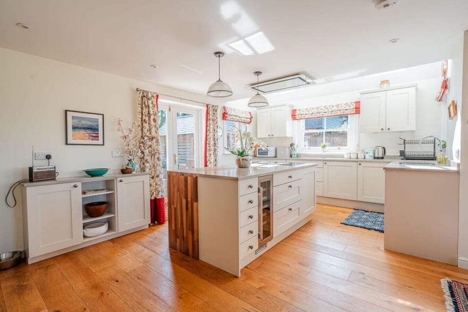 Open plan kitchen with all essentials utensils and equipment.
