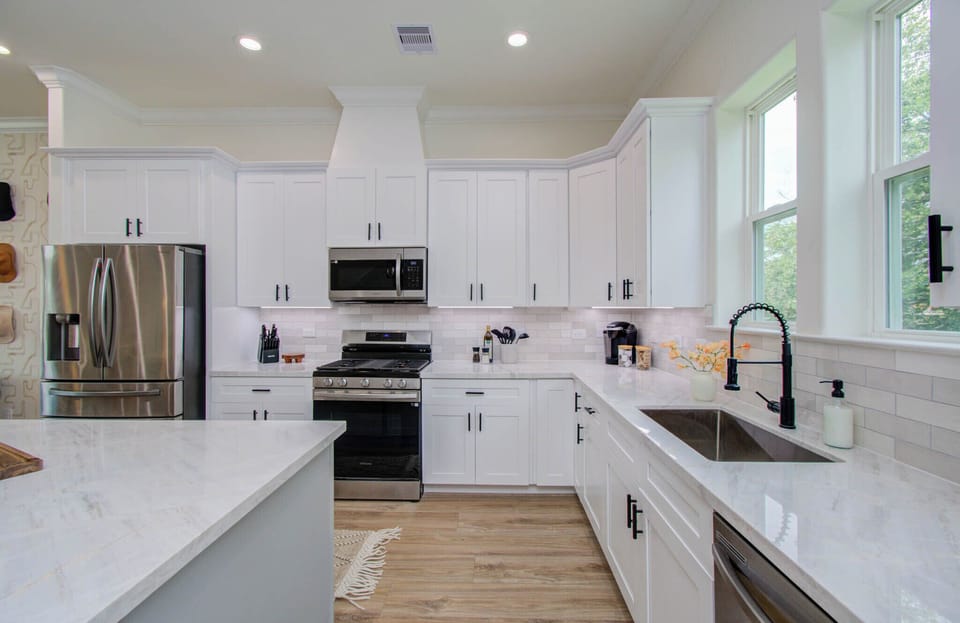 Spacious kitchen with ample cupboards and modern appliances