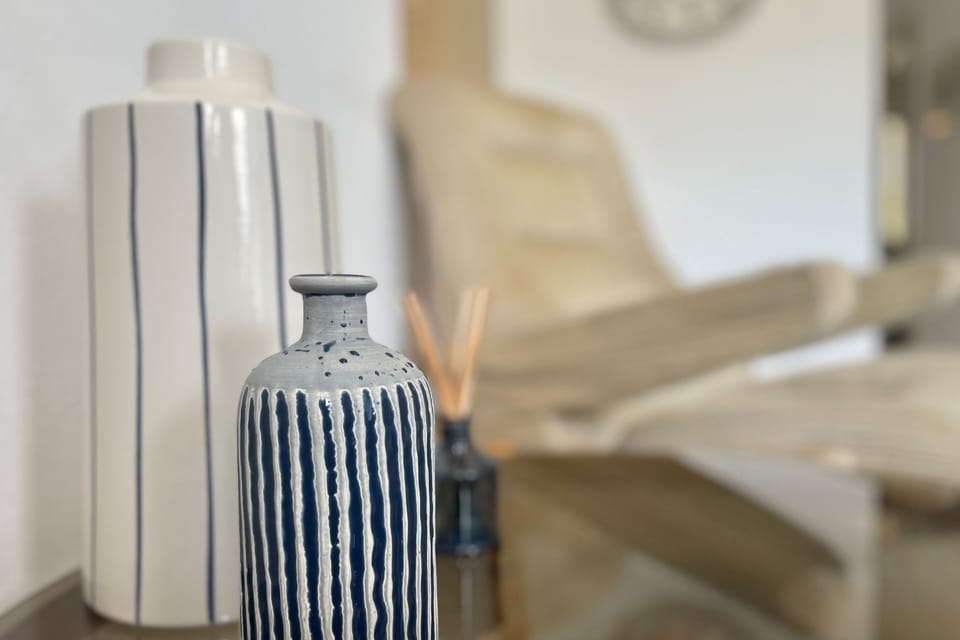 The apartment is decorated with local pottery and prints
